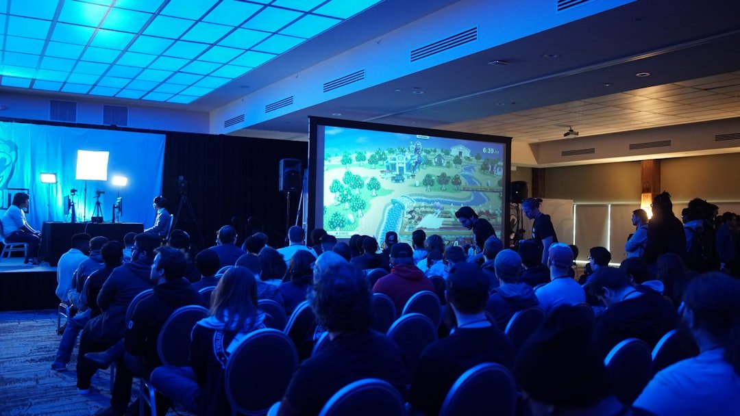 Corporate conference audience facing a stage during a live business event